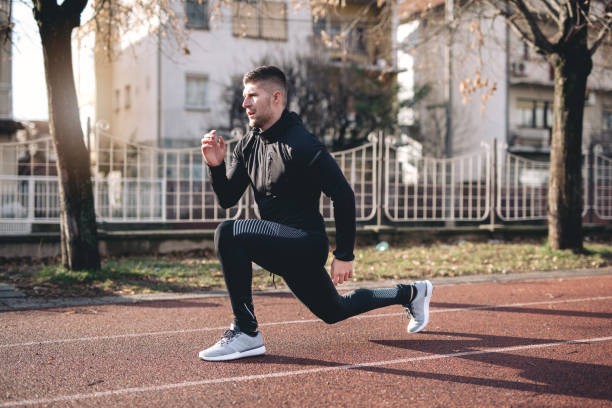 Handsome and athletic man, exercising outdoors, living the healthy lifestyle.